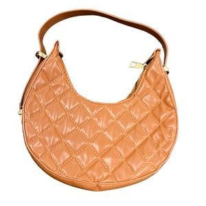 Saddle style adjustable straps brown handbag only used in a photo shoot